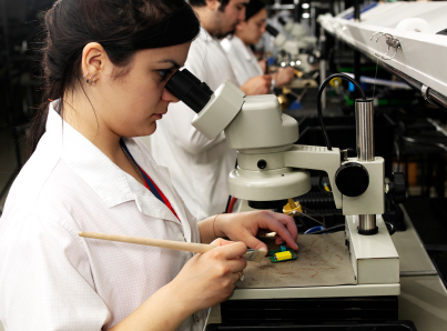 Woman working at microscope--iStock_000012611608XSmall.jpg